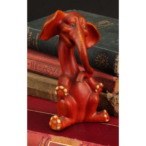 3051 - An Art Deco Grafton China comical model of an elephant, seated with elongated neck and curling trunk... 