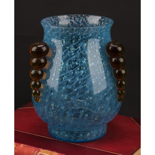 3230 - A studio glass vase, the blue ovoid body with flecked inclusions, three graduated bubble lug handles... 