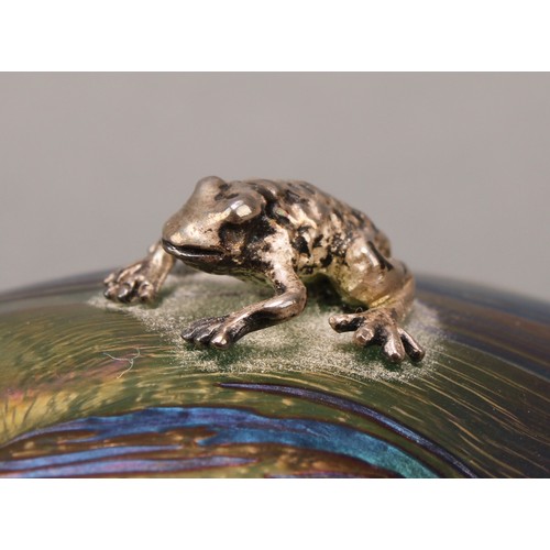 3218 - A John Ditchfield Glasform ovoid iridescent paperweight, with hallmarked silver frog, 6.5cm high, en... 