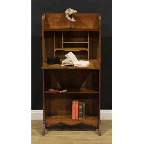 3412 - An Arts and Crafts oak bureau bookcase, shaped three-quarter gallery, fall front with beaten copper ... 