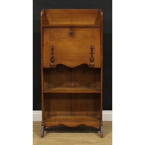 3412 - An Arts and Crafts oak bureau bookcase, shaped three-quarter gallery, fall front with beaten copper ... 