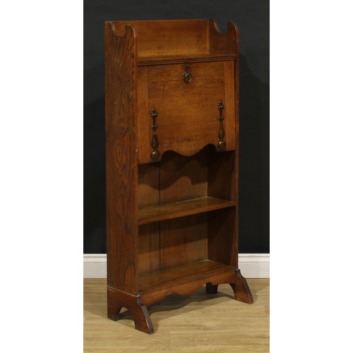 3412 - An Arts and Crafts oak bureau bookcase, shaped three-quarter gallery, fall front with beaten copper ... 