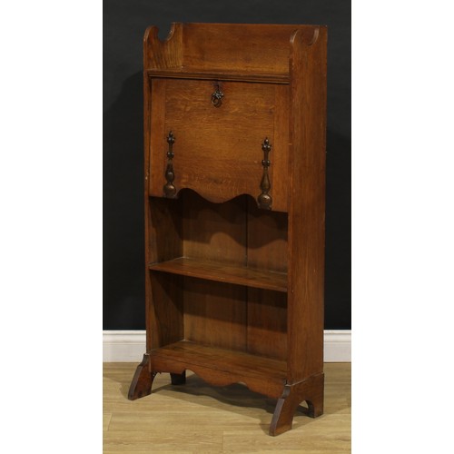 3412 - An Arts and Crafts oak bureau bookcase, shaped three-quarter gallery, fall front with beaten copper ... 