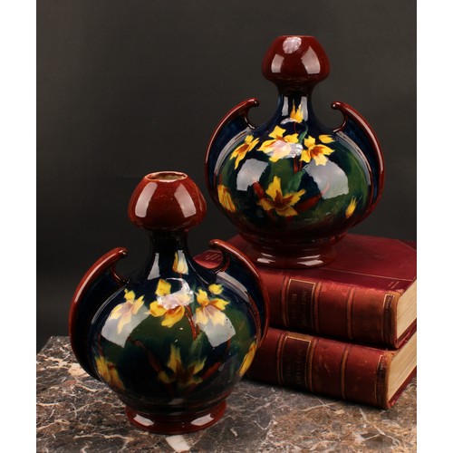 3032 - A pair of Austrian Art Nouveau Old Moravian Pottery vases, decorated impasto with flowers on a mottl... 