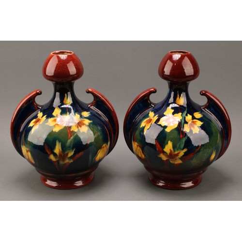 3032 - A pair of Austrian Art Nouveau Old Moravian Pottery vases, decorated impasto with flowers on a mottl... 