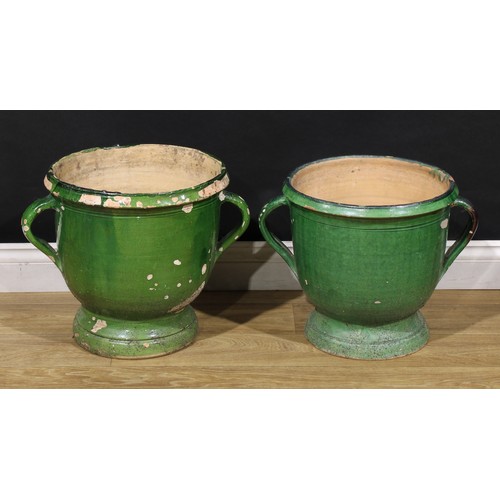 3074 - A near pair of 19th century French green glazed confit pots, probably South-West France, the largest... 