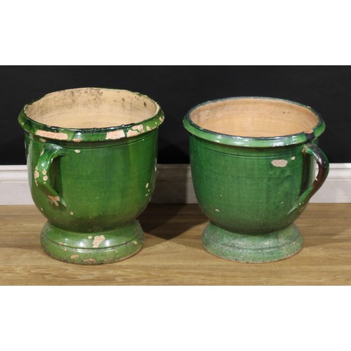 3074 - A near pair of 19th century French green glazed confit pots, probably South-West France, the largest... 