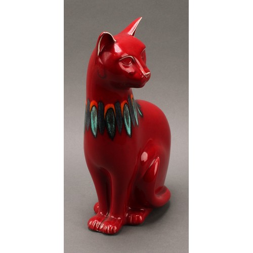 3076 - A Poole pottery model, of a cat, red Delphis glaze, 29.5cm high