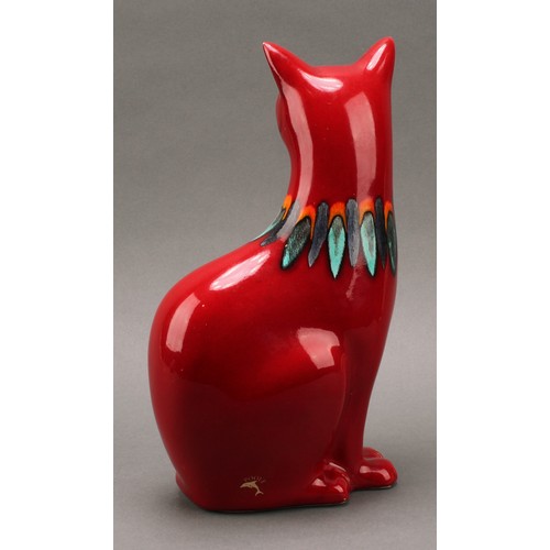 3076 - A Poole pottery model, of a cat, red Delphis glaze, 29.5cm high