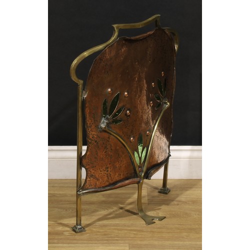 3377 - An Arts and Crafts copper, brass and green stained glass fire screen, the planished banner pierced i... 