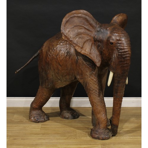 3342 - A large mid-20th century leather wrapped model of an elephant, in the manner of Liberty, possibly a ... 