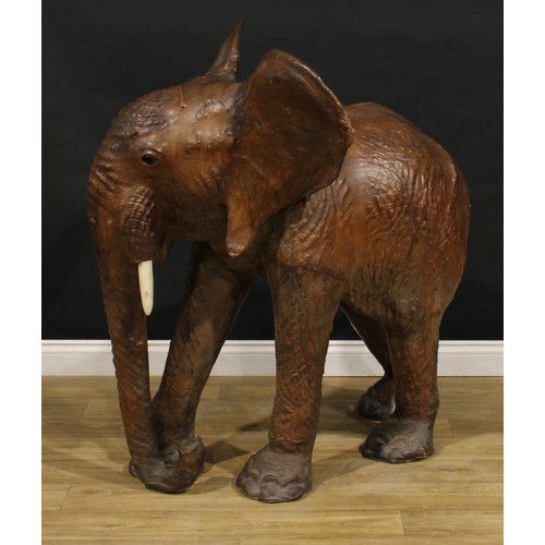 3342 - A large mid-20th century leather wrapped model of an elephant, in the manner of Liberty, possibly a ... 