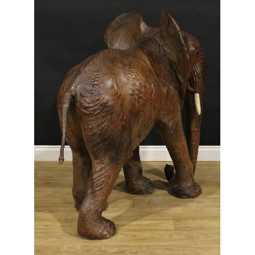 3342 - A large mid-20th century leather wrapped model of an elephant, in the manner of Liberty, possibly a ... 