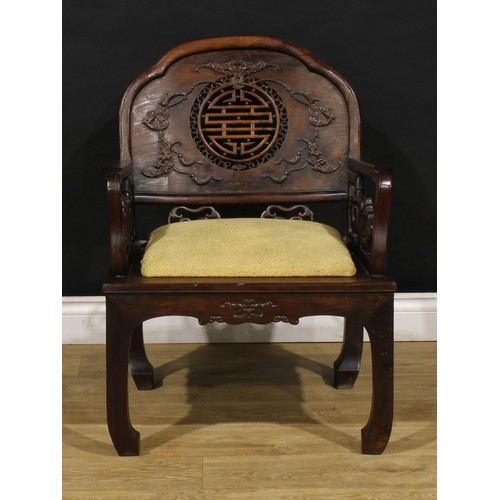 3410 - An Art Deco period Chinese hardwood elbow chair, shaped back carved with bats and coins and centred ... 