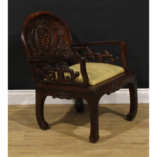 3410 - An Art Deco period Chinese hardwood elbow chair, shaped back carved with bats and coins and centred ... 