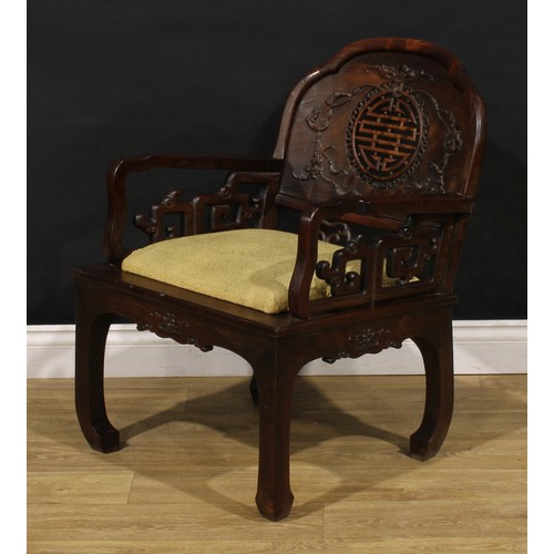 3410 - An Art Deco period Chinese hardwood elbow chair, shaped back carved with bats and coins and centred ... 