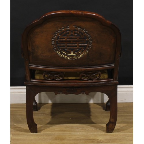 3410 - An Art Deco period Chinese hardwood elbow chair, shaped back carved with bats and coins and centred ... 