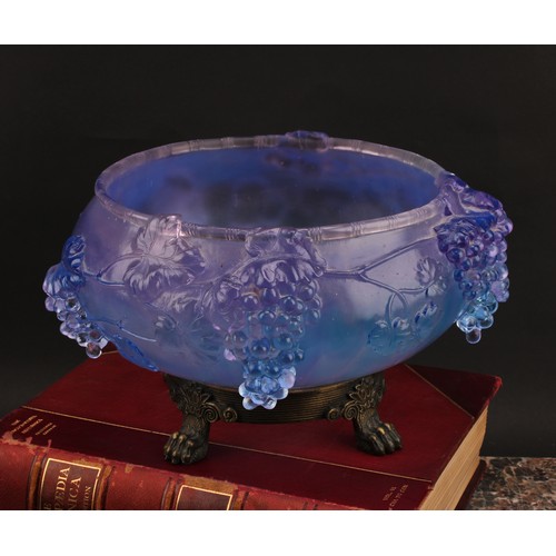 3224 - A moulded glass table centre, with cascading fruiting vine, in tones of lilac and blue, cast brass b... 