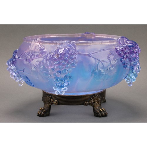 3224 - A moulded glass table centre, with cascading fruiting vine, in tones of lilac and blue, cast brass b... 