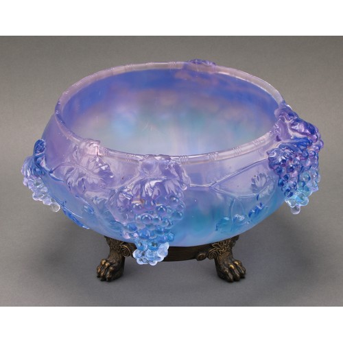 3224 - A moulded glass table centre, with cascading fruiting vine, in tones of lilac and blue, cast brass b... 