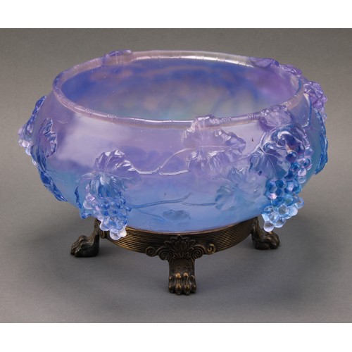 3224 - A moulded glass table centre, with cascading fruiting vine, in tones of lilac and blue, cast brass b... 