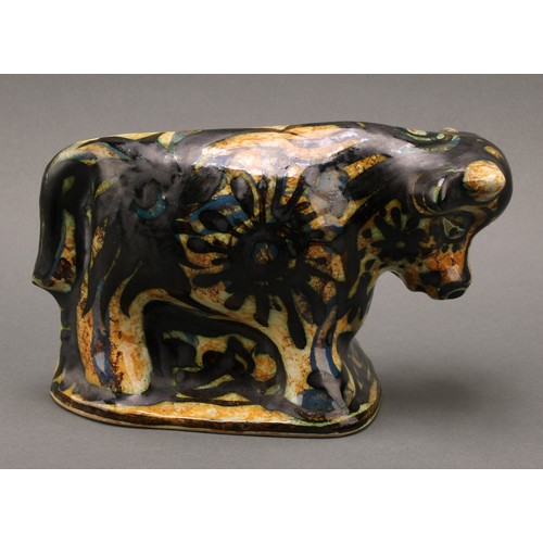 3213 - Studio Pottery - Maggi Fisher for Celtic Pottery, a stylised model of a bull, hand painted, 13.5cm h... 