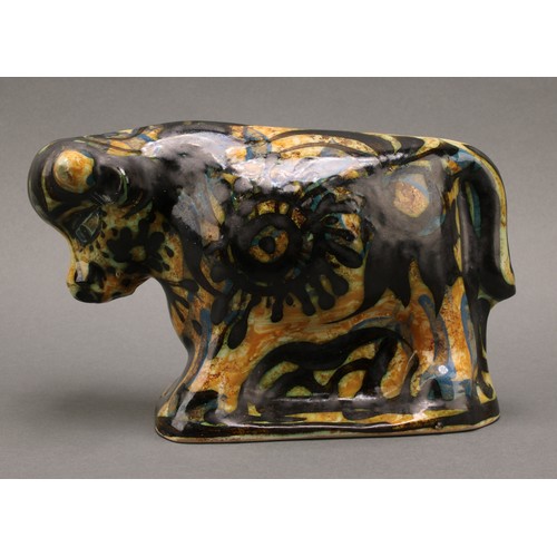 3213 - Studio Pottery - Maggi Fisher for Celtic Pottery, a stylised model of a bull, hand painted, 13.5cm h... 