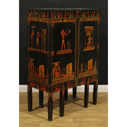 3415 - An Egyptian Revival design side cabinet, ebonised and polychrome decorated in the manner of The Grea... 