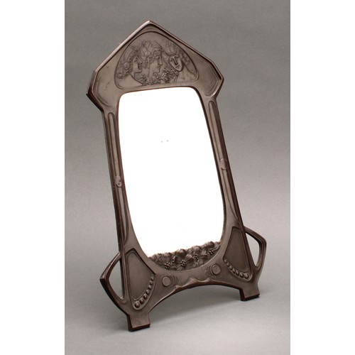 3362 - An Art Nouveau copper easel dressing table mirror, embossed with young girls in allusion to the Thre... 