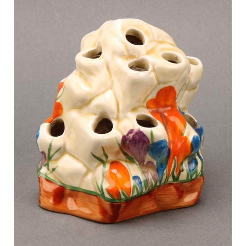 3015 - A Clarice Cliff, Crocus pattern posy vase or flower frog, modelled as a rocky outcrop, 9cm high