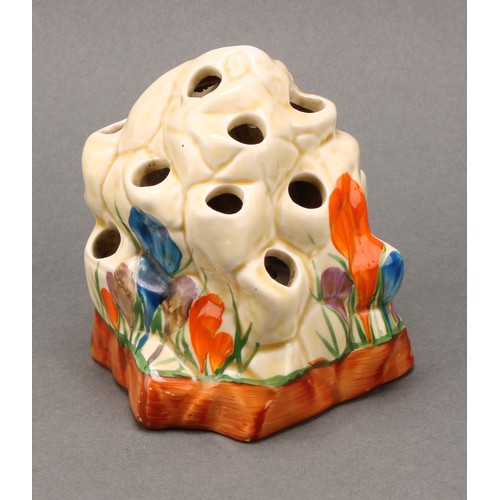 3015 - A Clarice Cliff, Crocus pattern posy vase or flower frog, modelled as a rocky outcrop, 9cm high