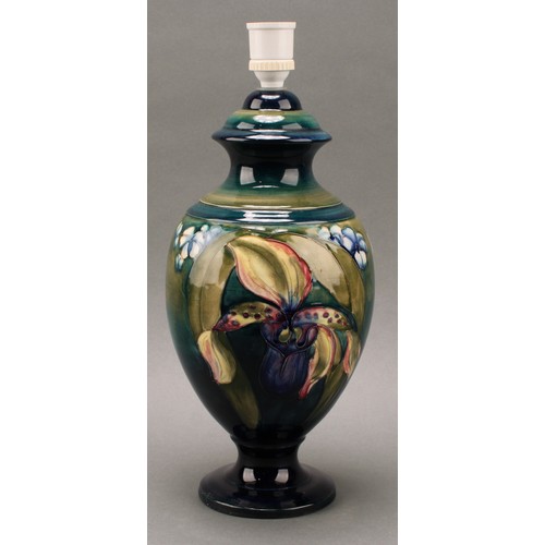 3125 - A Moorcroft Orchid pattern ovoid pedestal table lamp, tube lined with large flowerheads in tones of ... 