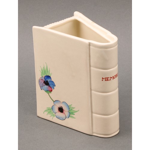 3014 - A Clarice Cliff Memories book vase, hand painted with flowers, the spine inscribed ‘Memories’, 12cm ... 