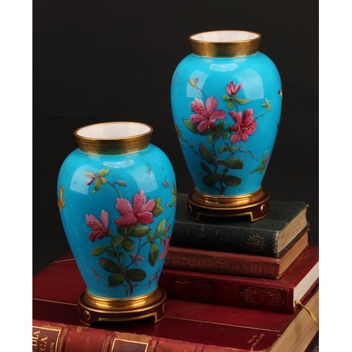 3035 - A pair of Mintons Aesthetic Movement chinoiserie ovoid vases, enamelled with blossom and insects on ... 