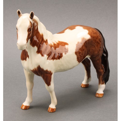 3078 - A Royal Doulton model of an Appaloosa horse, 20cm, printed mark; a Beswick skewbald Pinto pony, 17cm... 