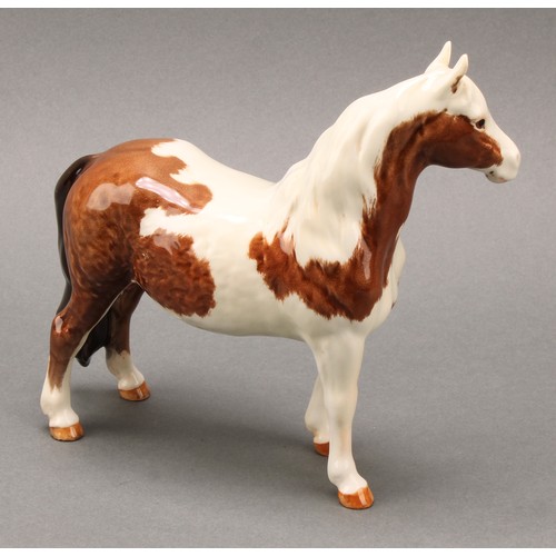 3078 - A Royal Doulton model of an Appaloosa horse, 20cm, printed mark; a Beswick skewbald Pinto pony, 17cm... 