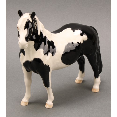 3078 - A Royal Doulton model of an Appaloosa horse, 20cm, printed mark; a Beswick skewbald Pinto pony, 17cm... 