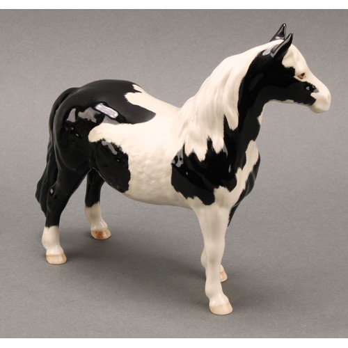 3078 - A Royal Doulton model of an Appaloosa horse, 20cm, printed mark; a Beswick skewbald Pinto pony, 17cm... 