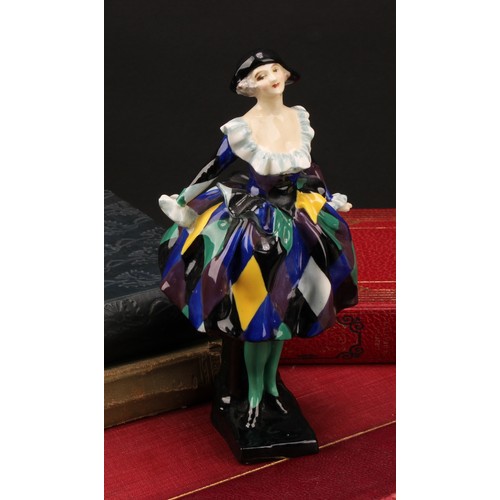 3099 - A Royal Doulton figure of Harlequinade HN 585, marks to base, 18cm high