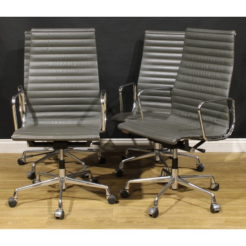 3307 - 20th Century Design - a set of four swivel office chairs, after a design by Charles & Ray Eames for ... 