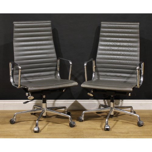 3303 - 20th Century Design - a pair of swivel office chairs, after a design by Charles & Ray Eames for Herm... 