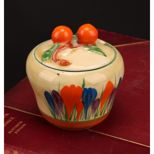 3005 - A Clarice Cliff Crocus pattern waisted preserve pot and cover, painted in colours with crocuses, ban... 