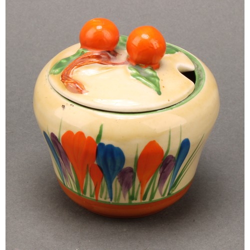 3005 - A Clarice Cliff Crocus pattern waisted preserve pot and cover, painted in colours with crocuses, ban... 