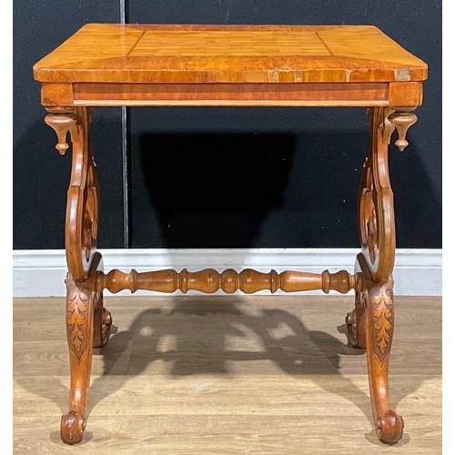 117 - A Victorian satinwood games table, rounded square top inlaid for chess, shaped end supports pierced ... 