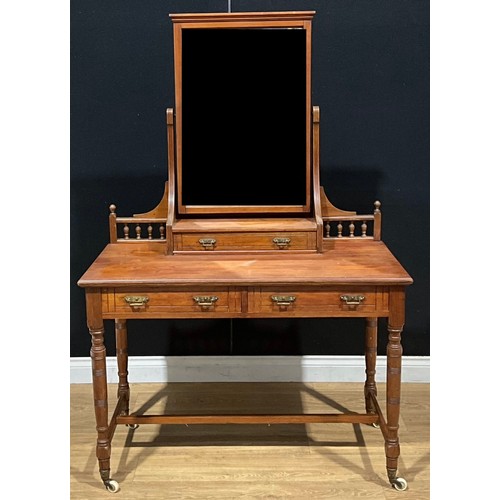 119 - A Victorian Aesthetic Movement pitch pine dressing table, 159cm high, 106.5cm wide, 50cm deep