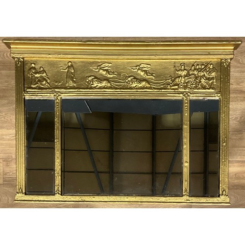 438 - A Regency style giltwood triple-plate chimney glass, the frieze applied with Mars on a chariot drawn... 