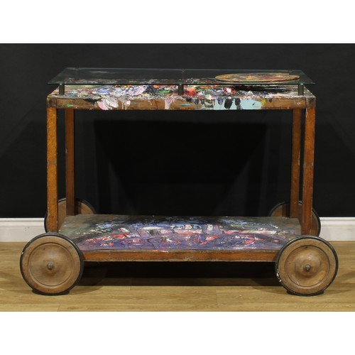 3343 - A mid-20th century artist’s studio table, glazed rectangular top enclosing an accumulation of discar... 