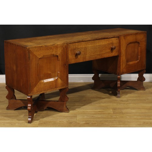 3374 - An Arts & Crafts oak sideboard, by Arthur Romney Green (1872-1945), flush rectangular top above a ce... 