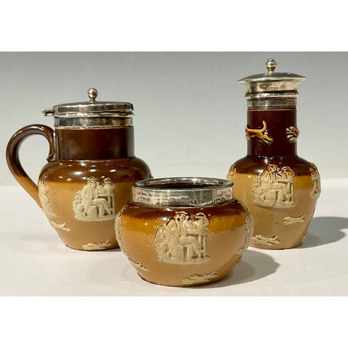 469 - An early 20th century Royal Doulton salt glazed silver mounted composed three-piece cruet set, Birmi... 