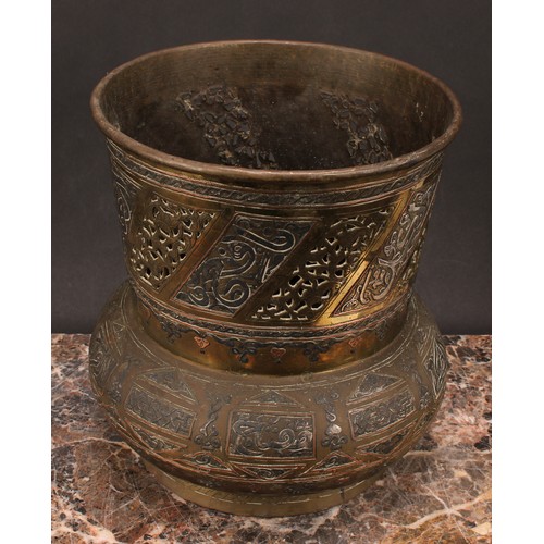 472 - A Middle-Eastern silvered and copper damascened brass mosque lamp, pierced and decorated with Arabic... 